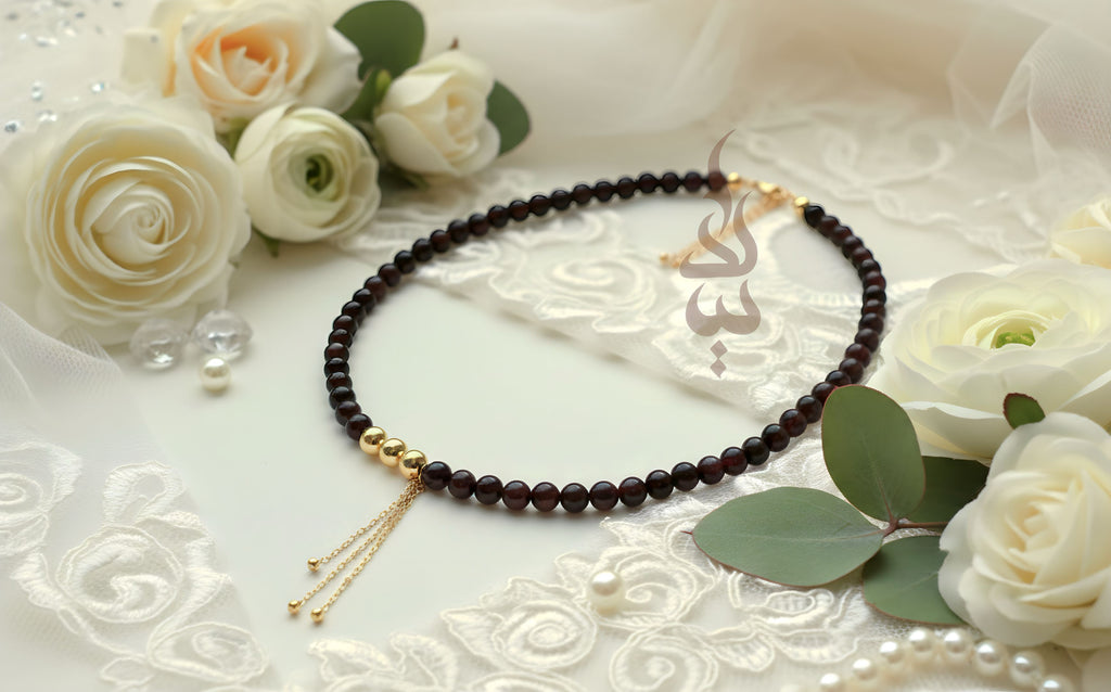Handcrafted necklace with 18K gold beads and chain paired with natural garnet stone