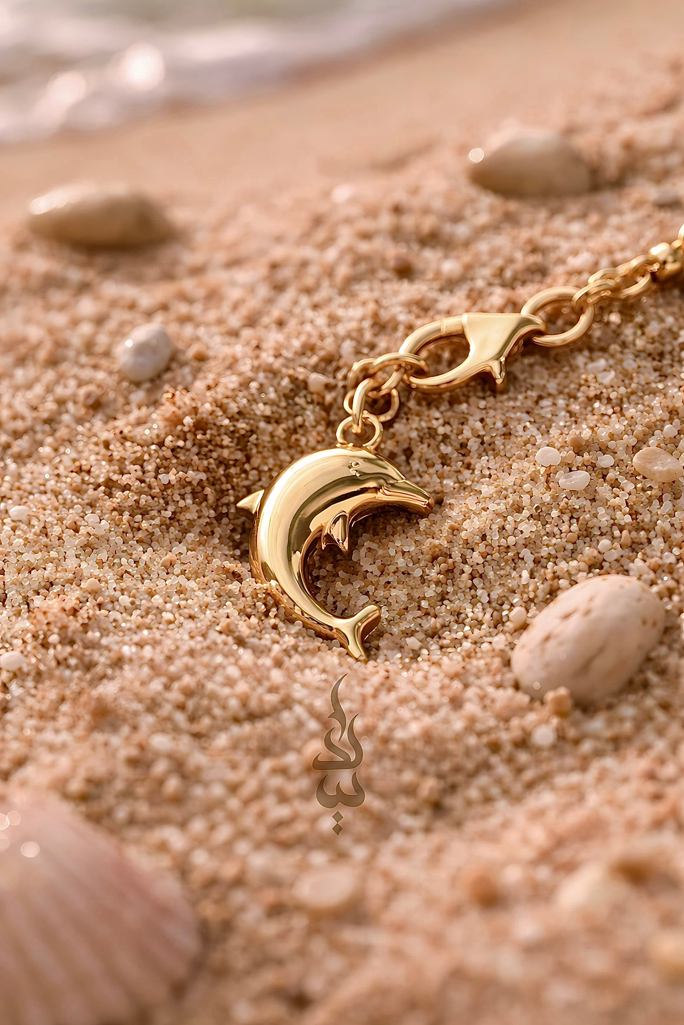 18K gold bracelet with a dolphin charm crafted with ammonite stone