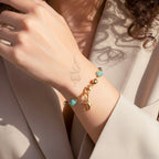 18K gold bracelet with a dolphin charm crafted with ammonite stone