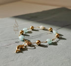 18K gold bracelet with a dolphin charm crafted with ammonite stone