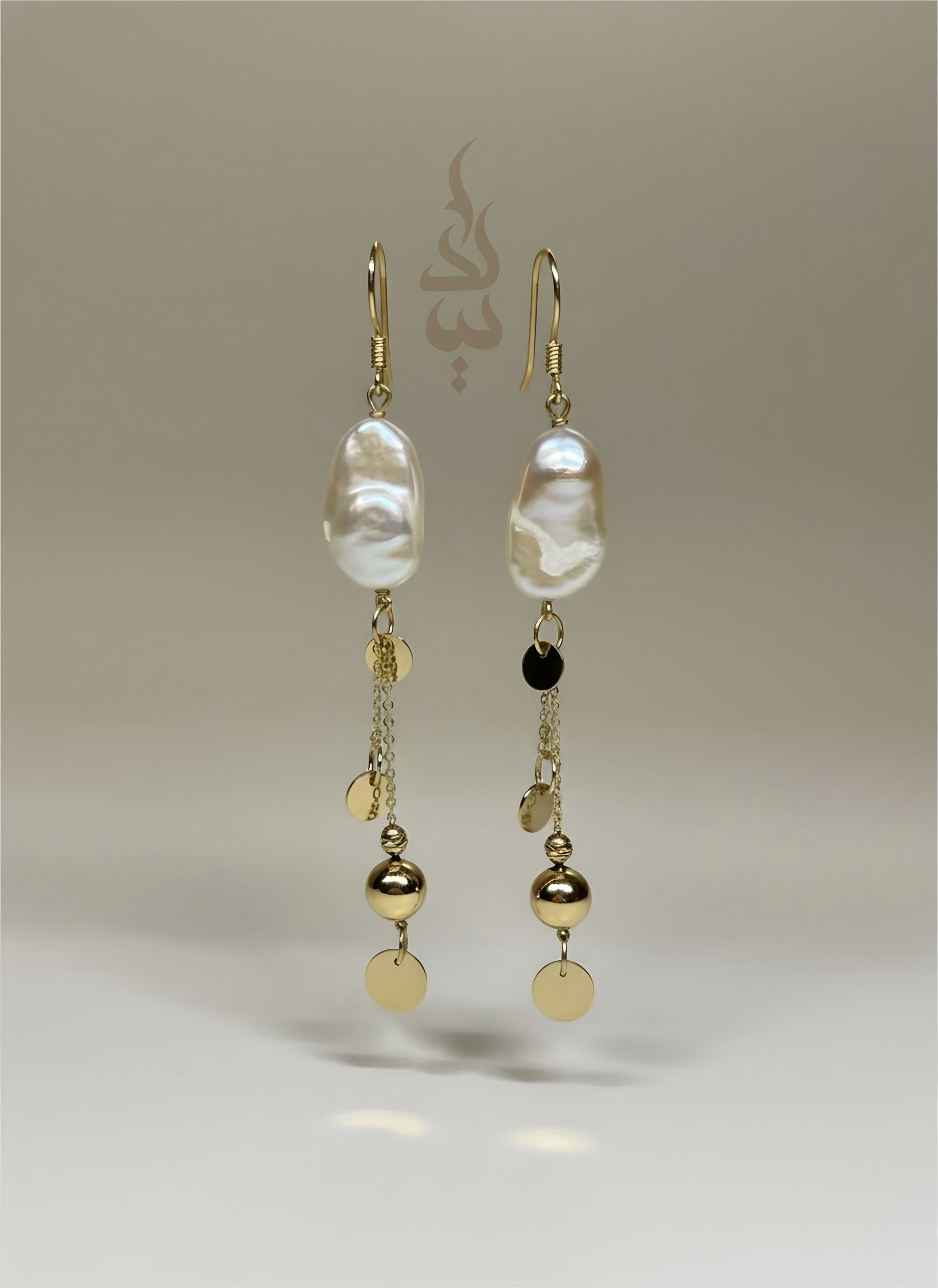 18K gold earrings crafted with a natural baroque pearl