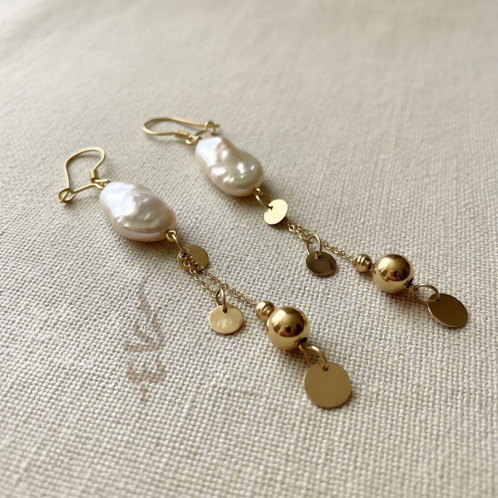 18K gold earrings crafted with a natural baroque pearl