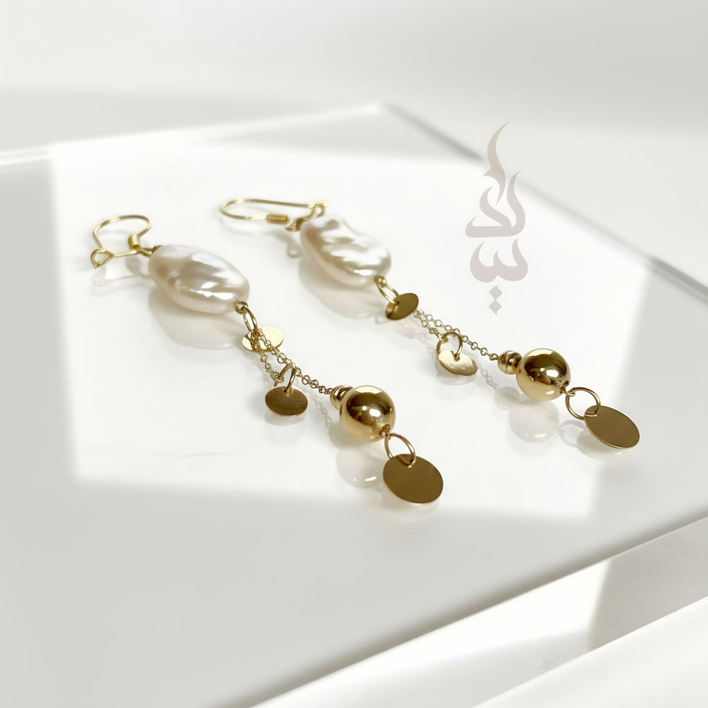 18K gold earrings crafted with a natural baroque pearl