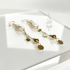 18K gold earrings crafted with a natural baroque pearl