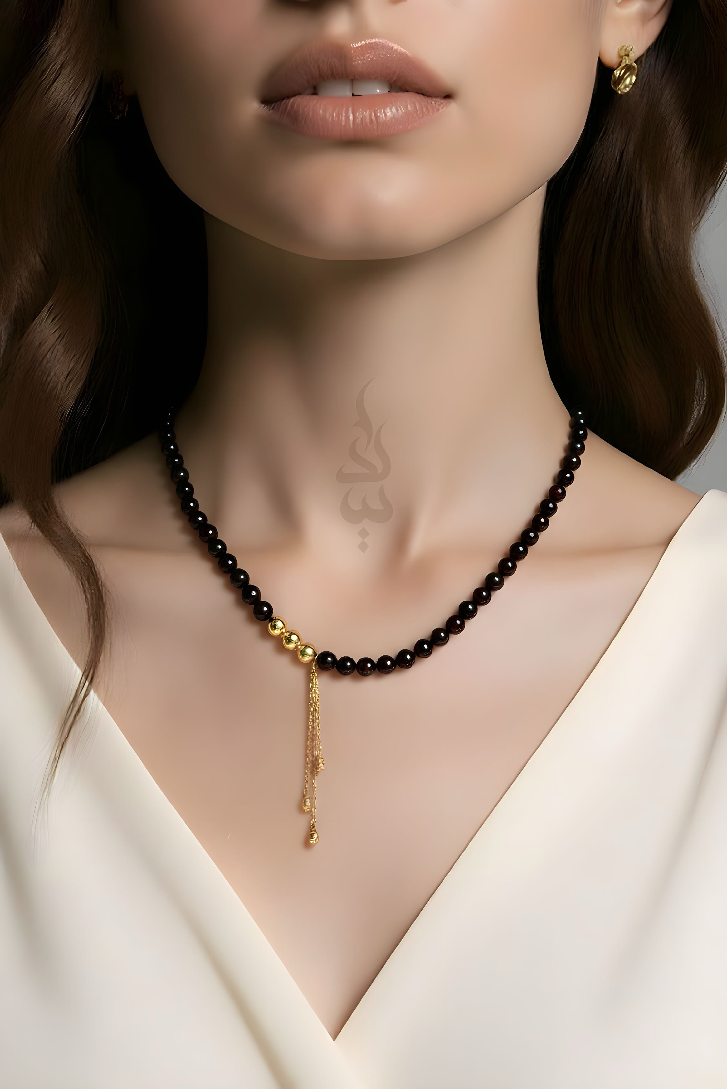 Handcrafted necklace with 18K gold beads and chain paired with natural garnet stone