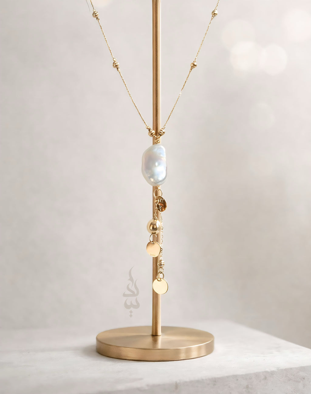 18K gold necklace with natural baroque pearl