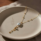 18K gold necklace with natural baroque pearl