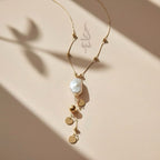 18K gold necklace with natural baroque pearl