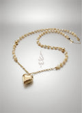 18K gold necklace with a heart pendant crafted with shell