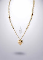 18K gold necklace with a heart pendant crafted with shell