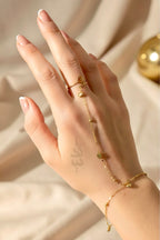 18K Gold hand chain with delicate heart charms and tiny beads