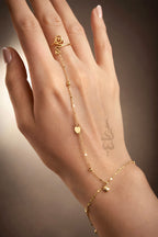 18K Gold hand chain with delicate heart charms and tiny beads