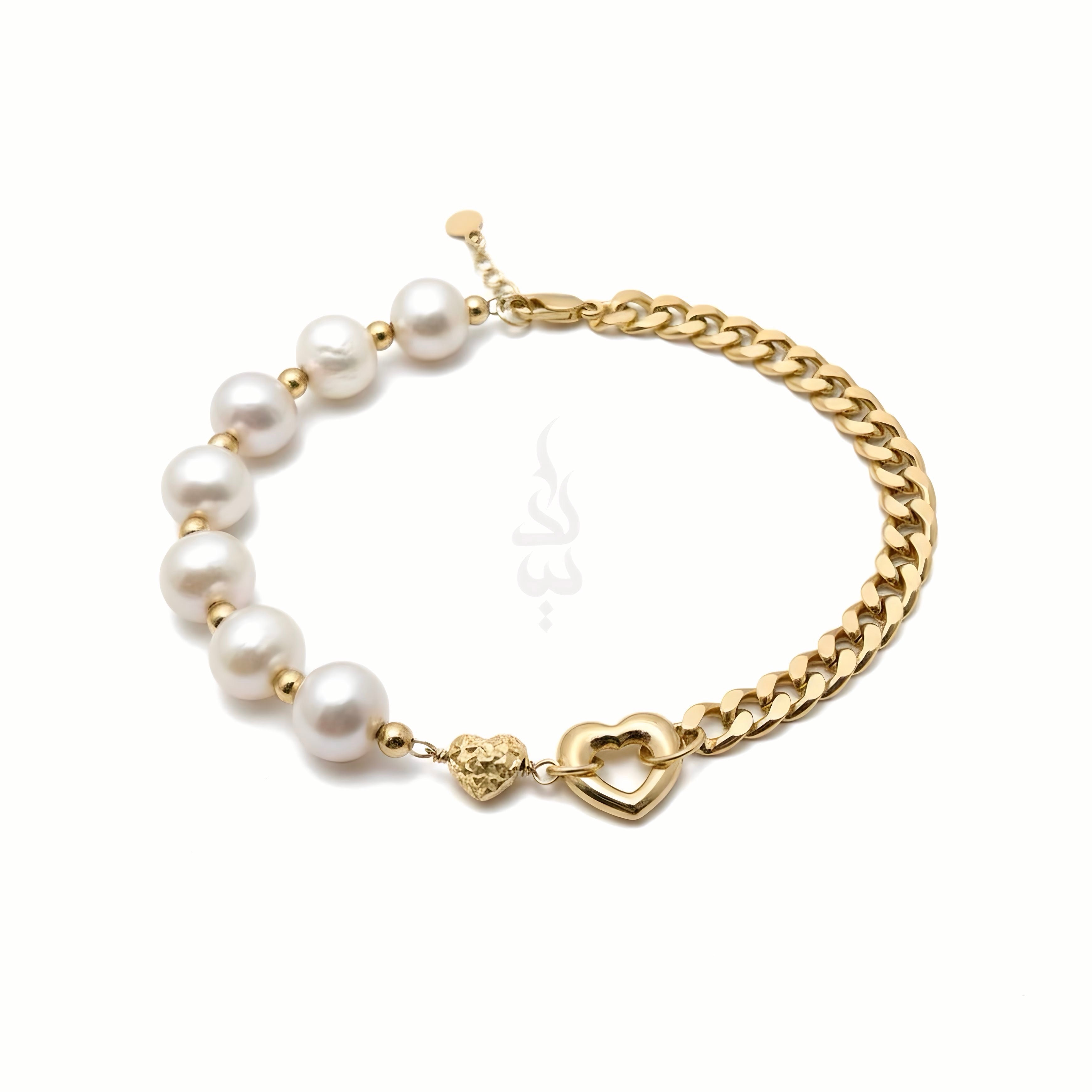18K gold bracelet with a heart charm crafted with natural pearls