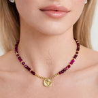 18K gold necklace crafted with ruby stones and Versace pendant
