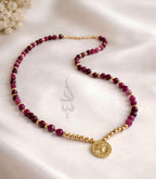 18K gold necklace crafted with ruby stones and Versace pendant