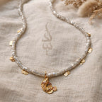 18K gold necklace with a fish pendant and shiny gold scales
