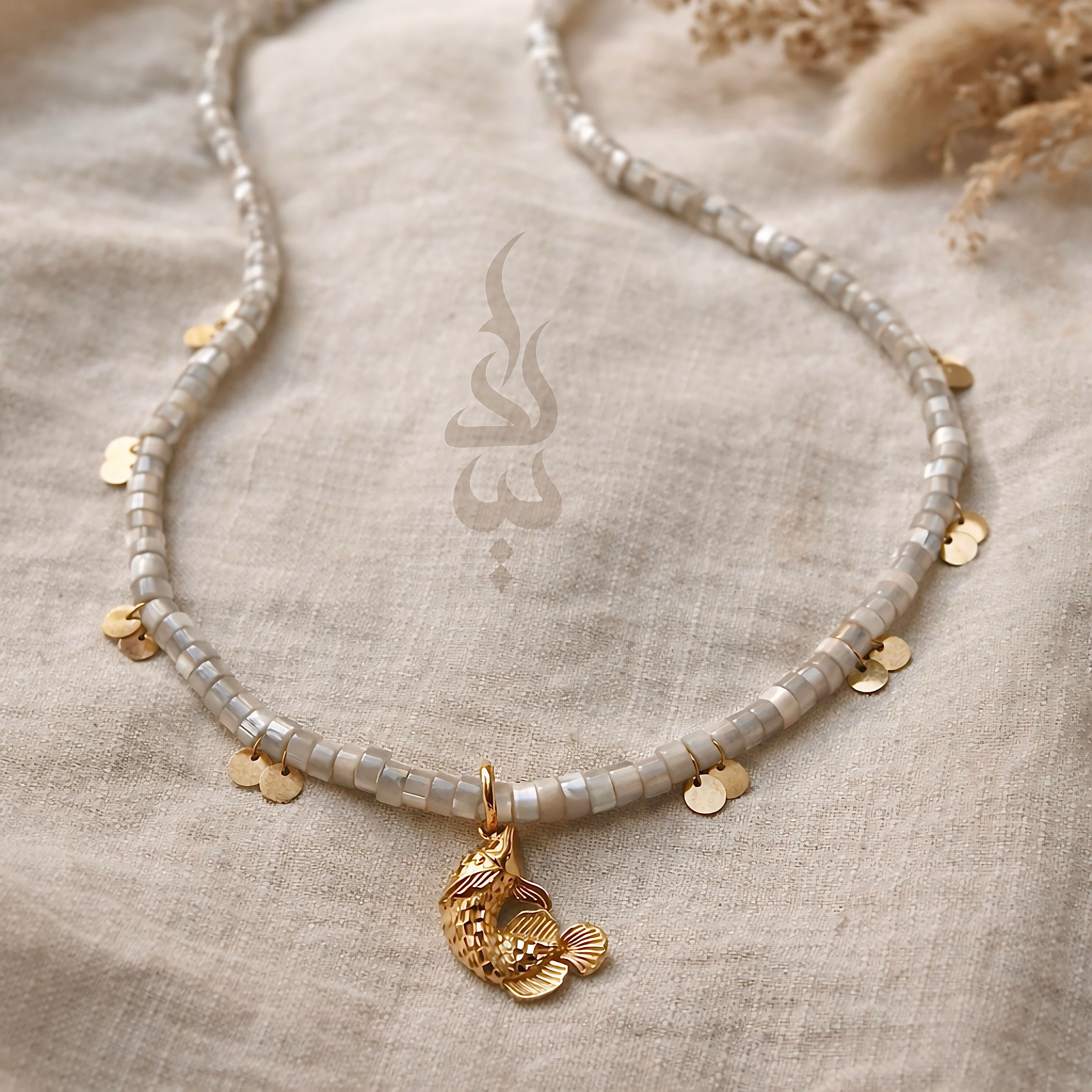 18K gold necklace with a fish pendant and shiny gold scales