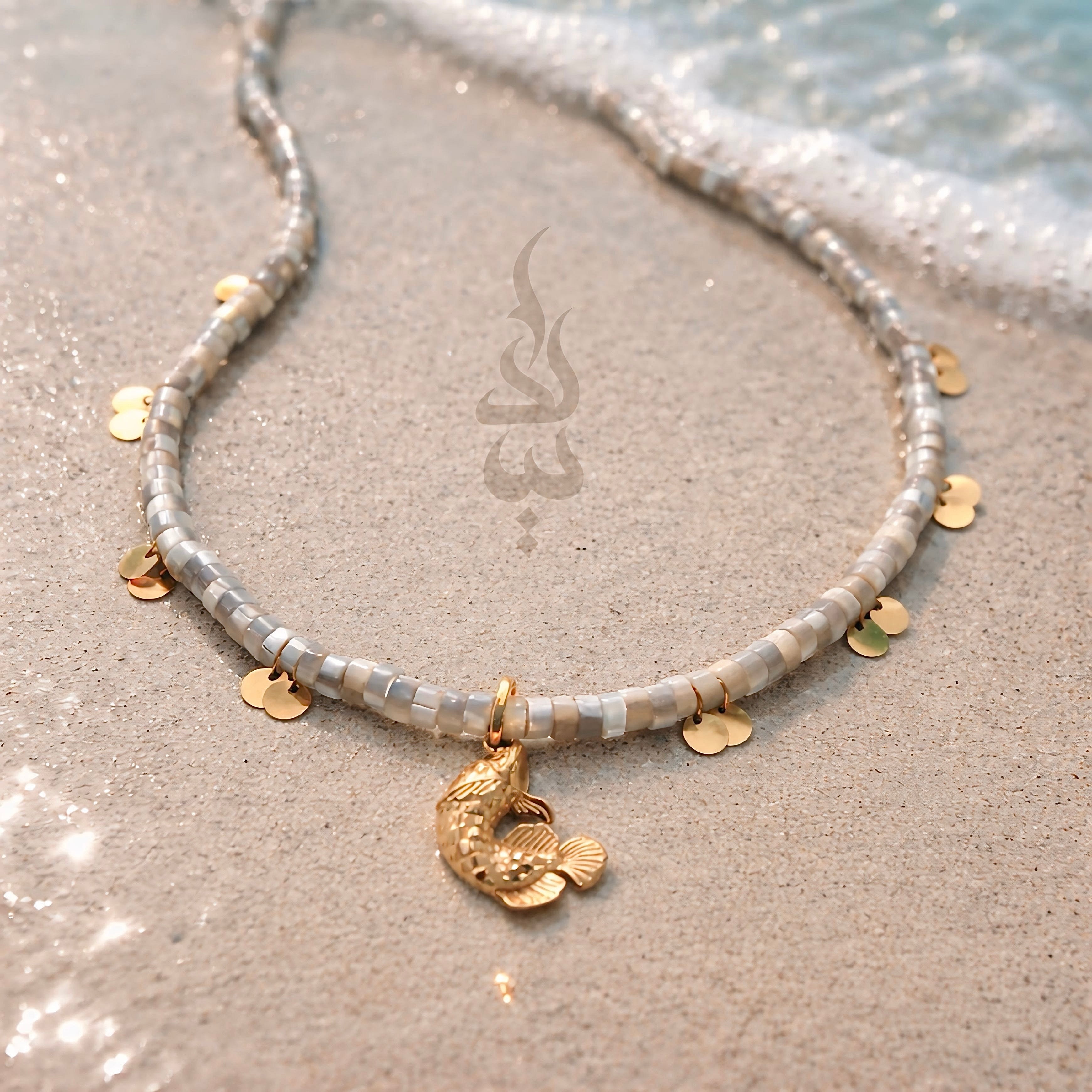 18K gold necklace with a fish pendant and shiny gold scales