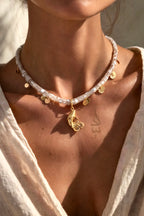 18K gold necklace with a fish pendant and shiny gold scales