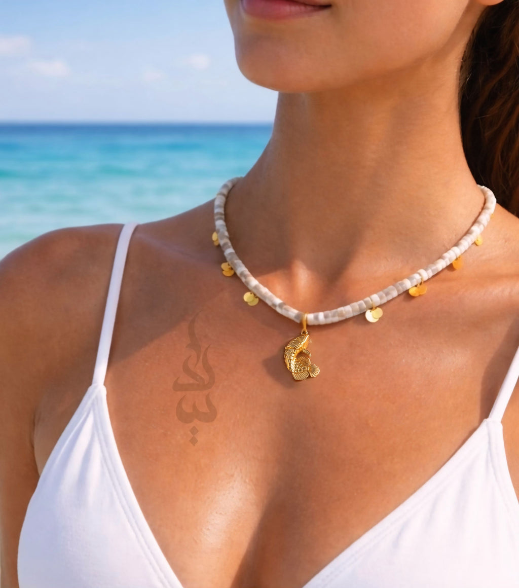 18K gold necklace with a fish pendant and shiny gold scales