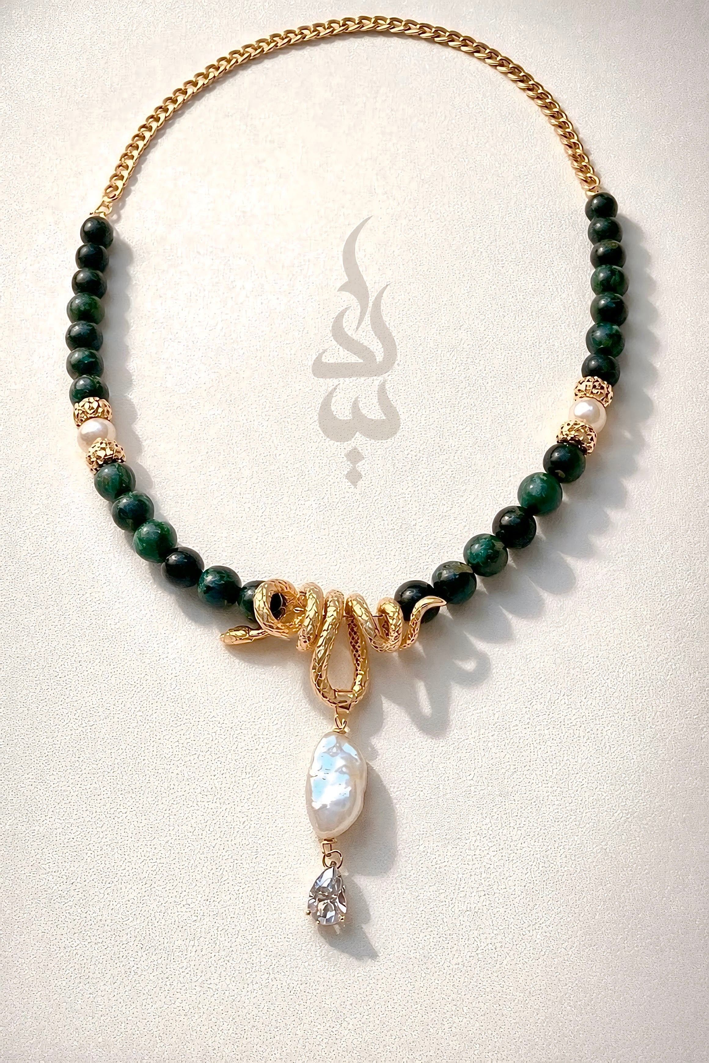 18K gold crafted with natural emerald and pearl with serpent pendant