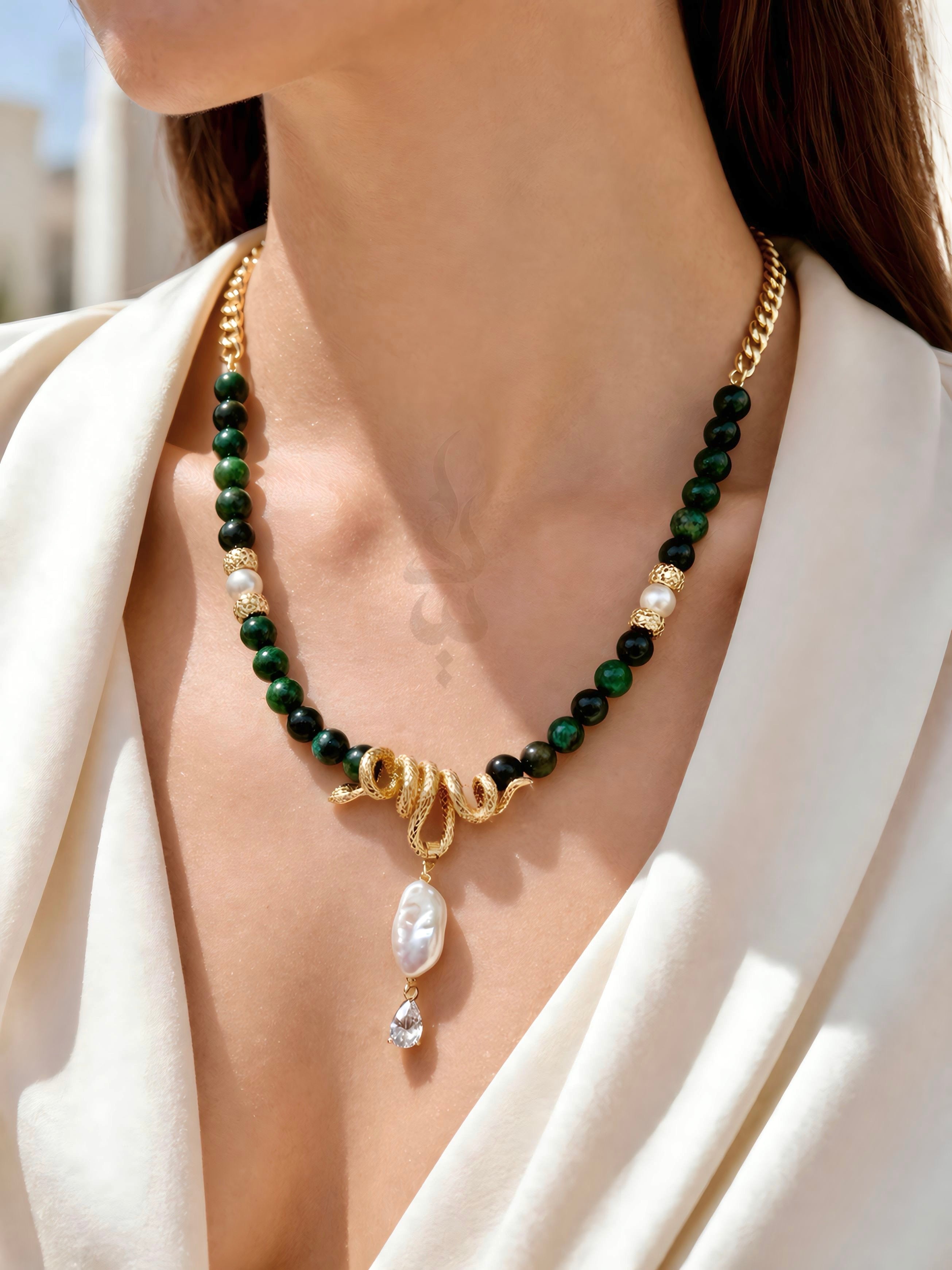 18K gold crafted with natural emerald and pearl with serpent pendant