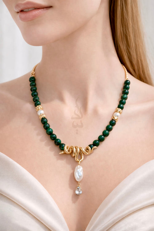 18K gold crafted with natural emerald and pearl with serpent pendant