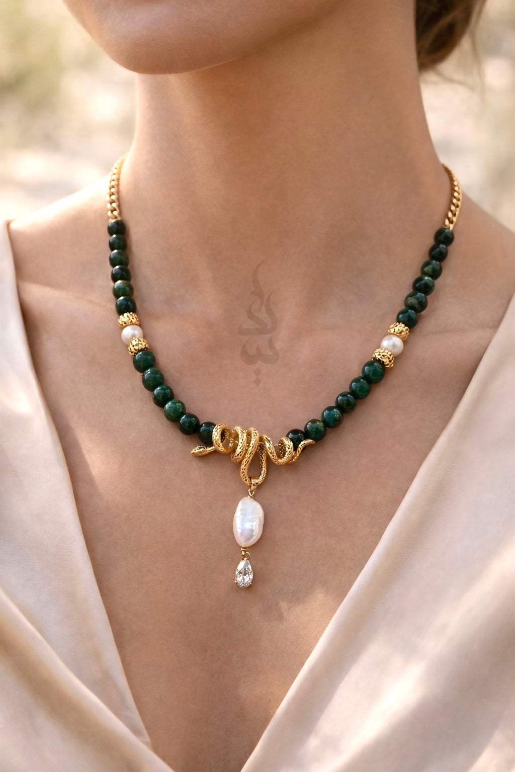 18K gold crafted with natural emerald and pearl with serpent pendant