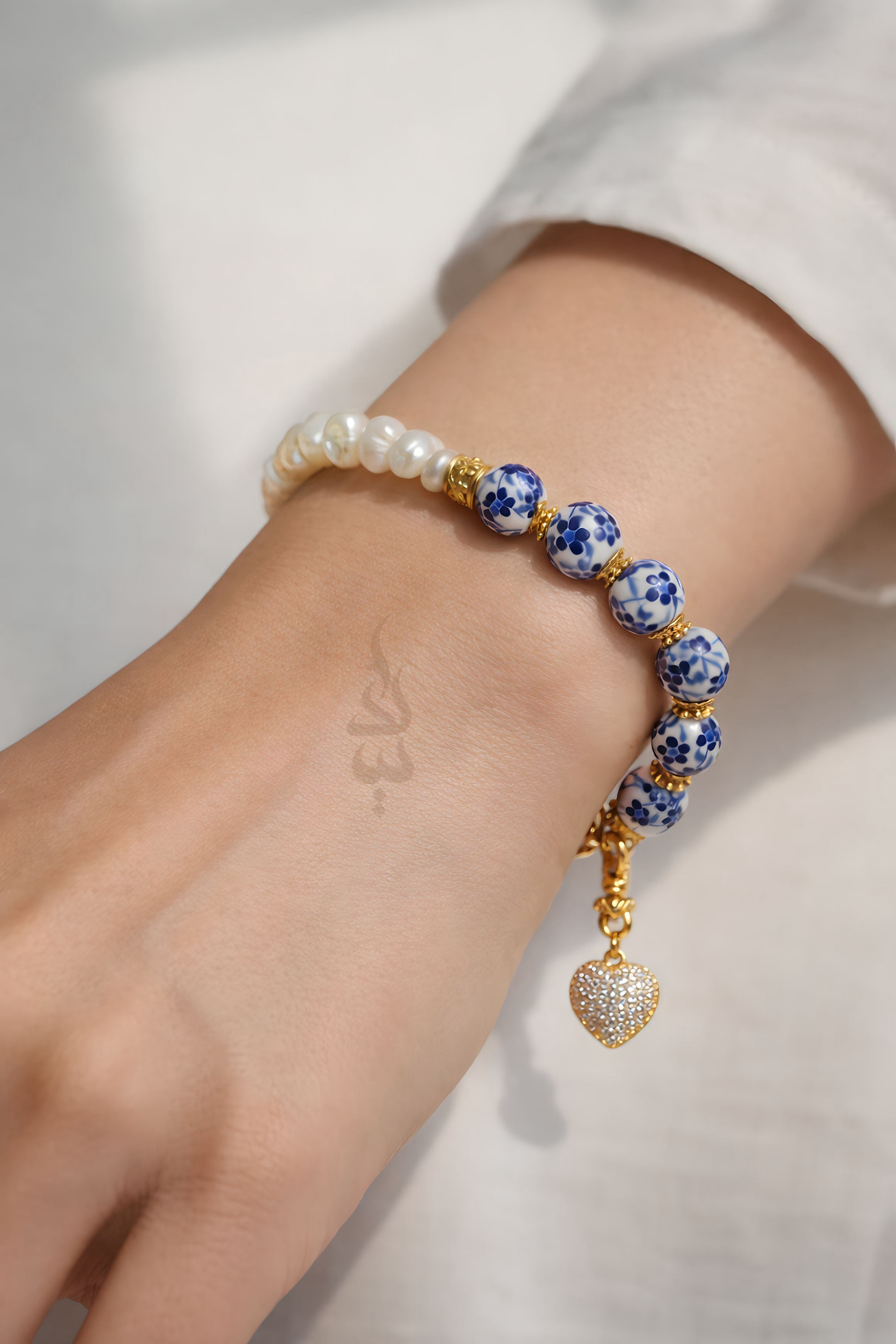 925 silver (18K gold plated) bracelet crafted with natural pearls and ceramicbeads