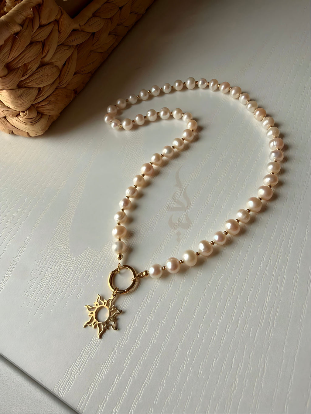 18K gold pearl necklace with sun pendant