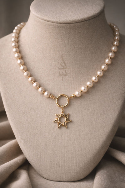 18K gold pearl necklace with sun pendant