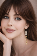 18K gold earrings crafted with a natural baroque pearl