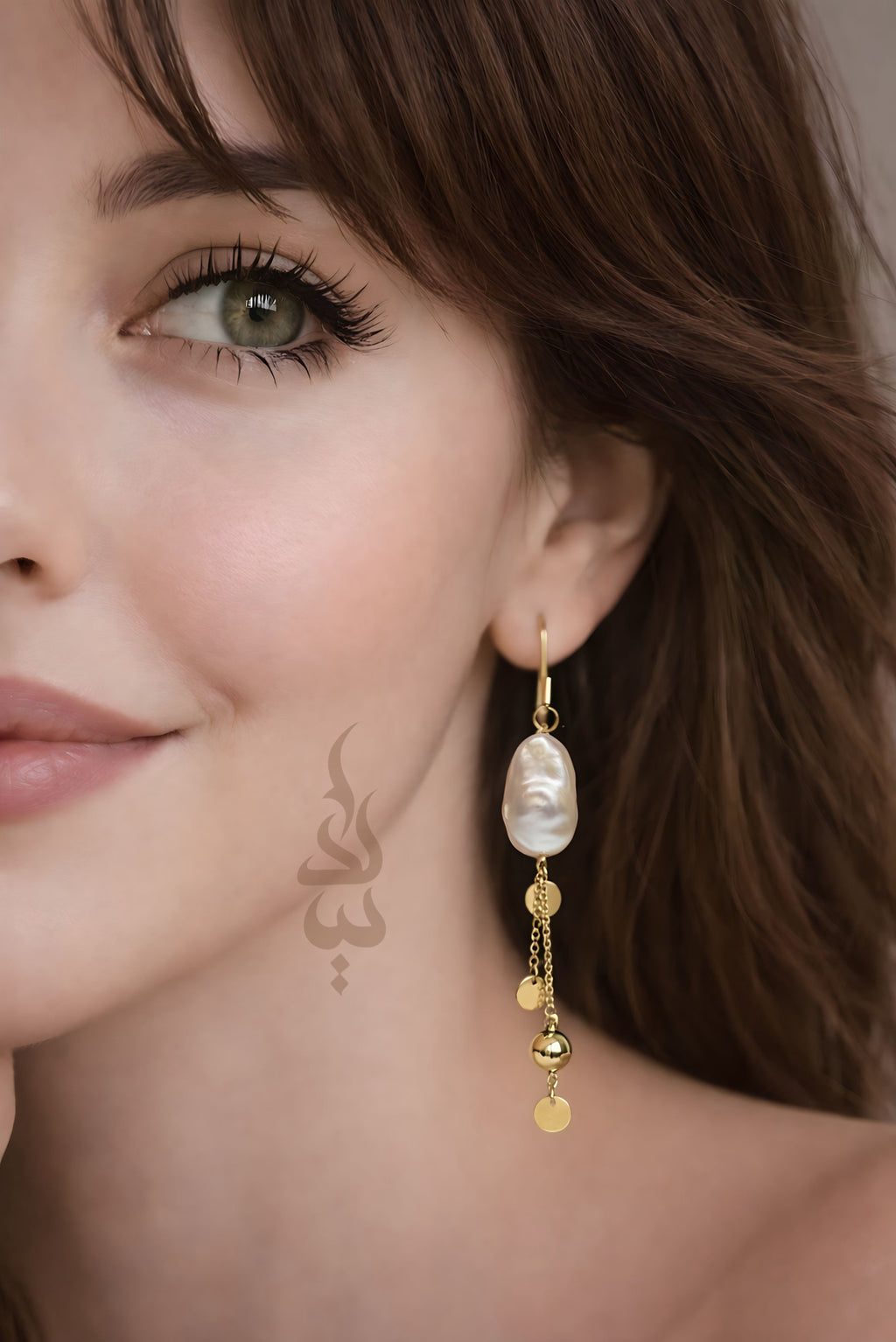 18K gold earrings crafted with a natural baroque pearl