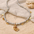 18K gold necklace with a fish pendant and shiny gold scales