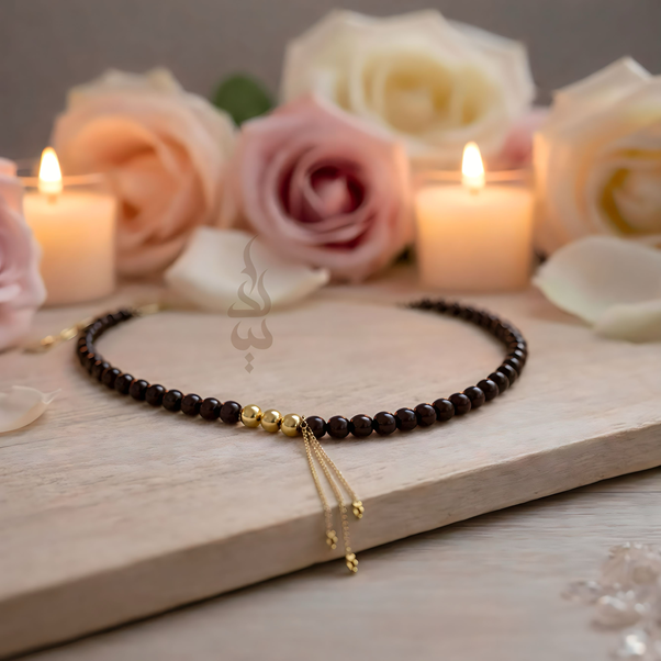 Handcrafted necklace with 18K gold beads and chain paired with natural garnet stone