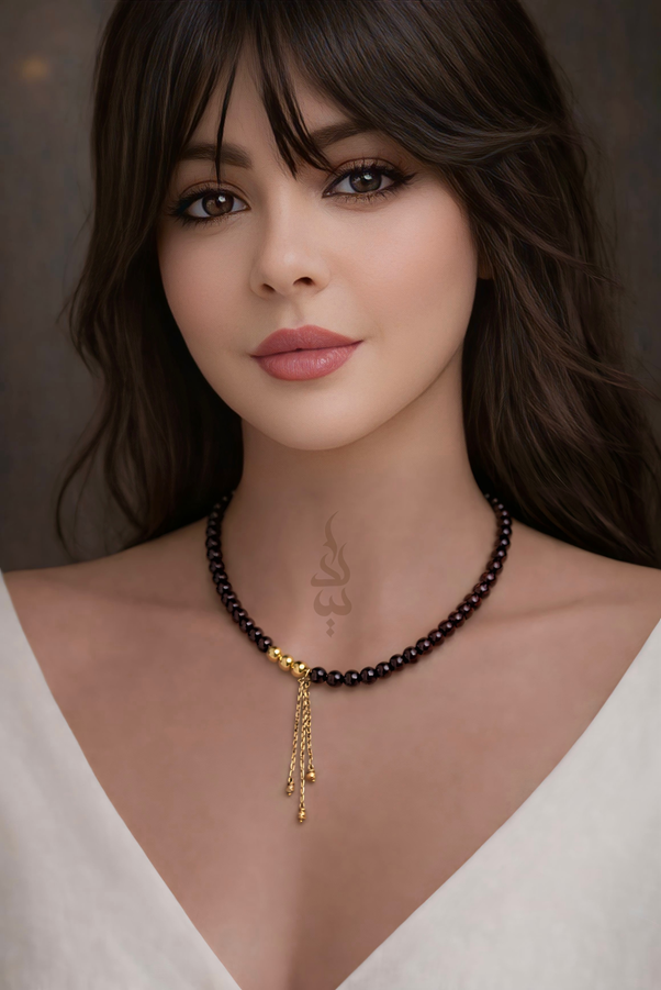 Handcrafted necklace with 18K gold beads and chain paired with natural garnet stone