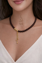 Handcrafted necklace with 18K gold beads and chain paired with natural garnet stone